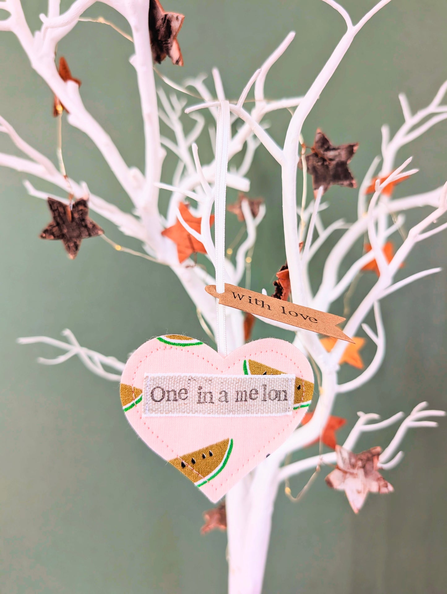 'One in a melon' hanging heart decoration with recycled plantable wildflower seed backing card