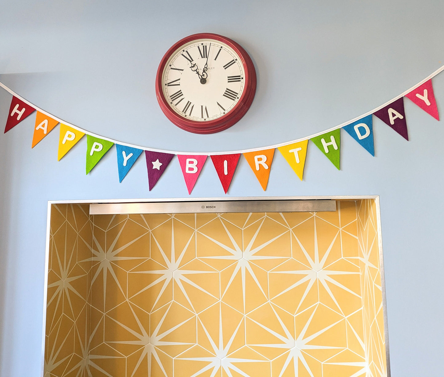 Custom personalised rainbow felt bunting with hand-cut lettering