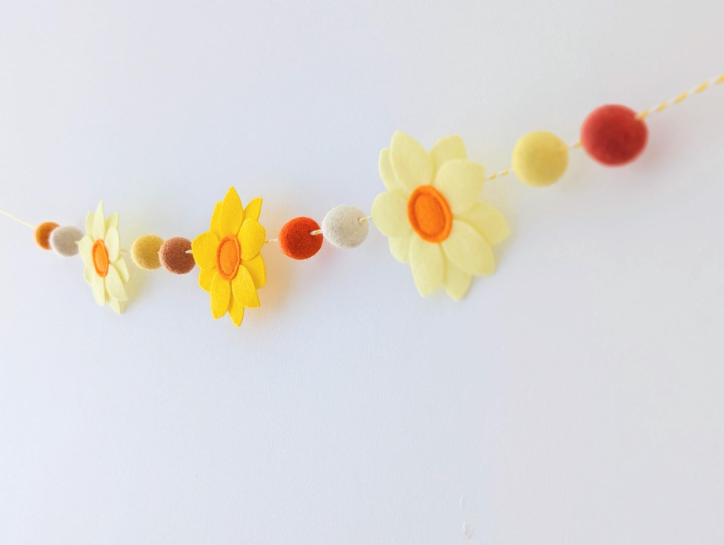 Yellow daffodil and felt ball garland: floral spring or Easter bunting