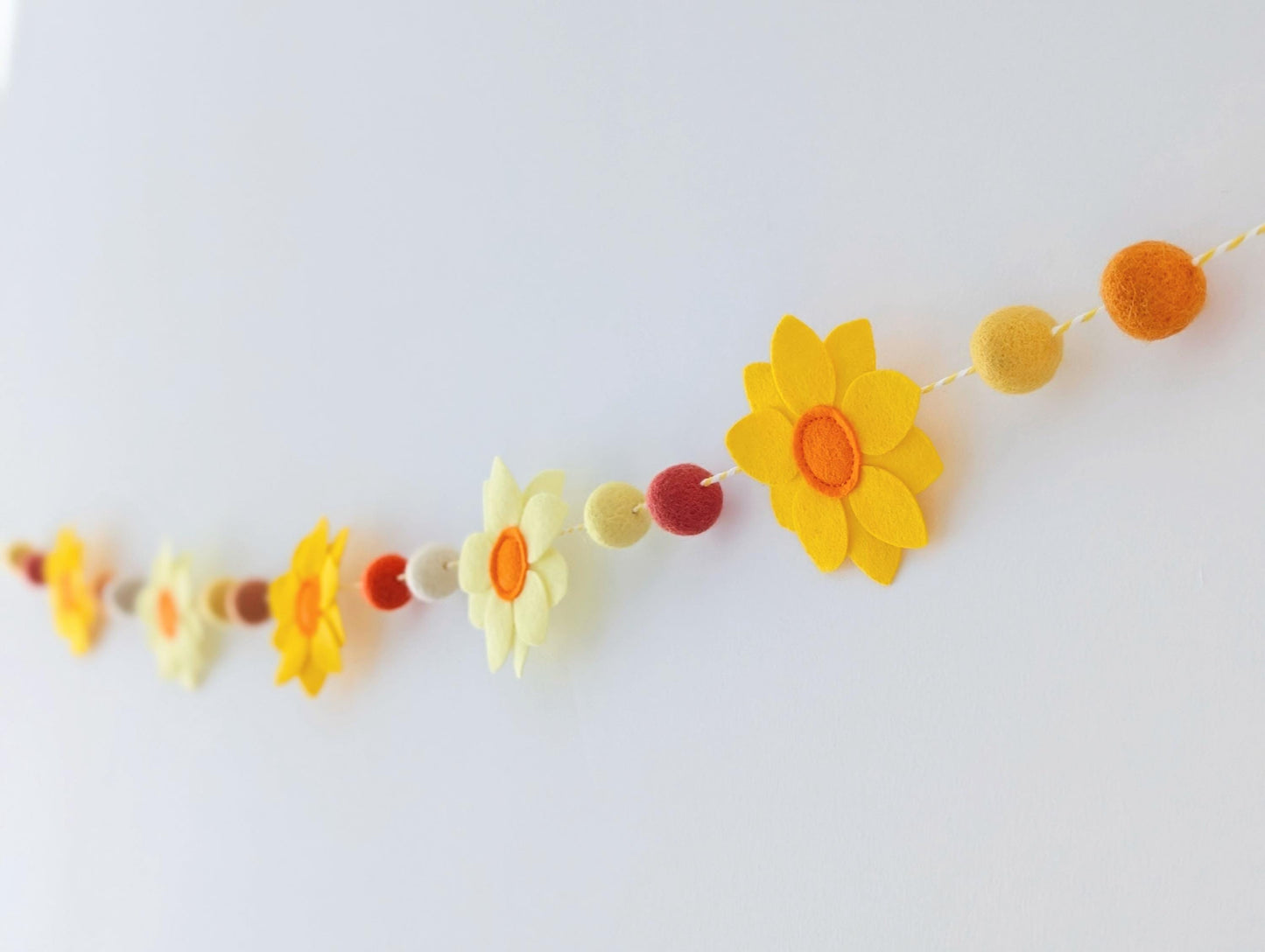 Yellow daffodil and felt ball garland: floral spring or Easter bunting