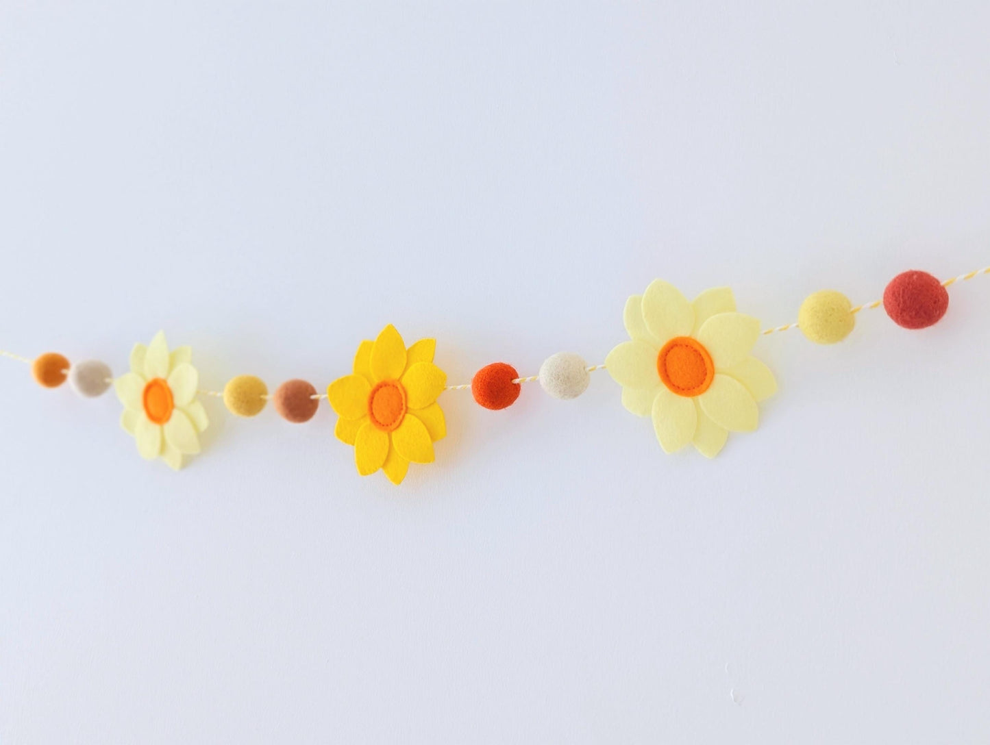 Yellow daffodil and felt ball garland: floral spring or Easter bunting