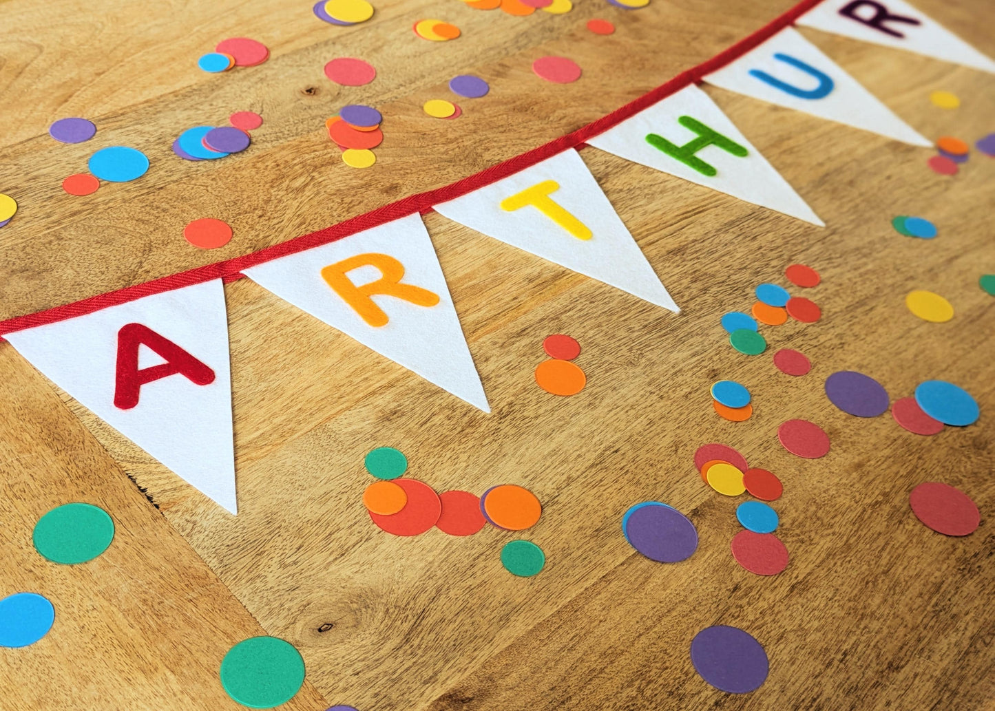 Custom personalised felt bunting with rainbow hand-cut lettering