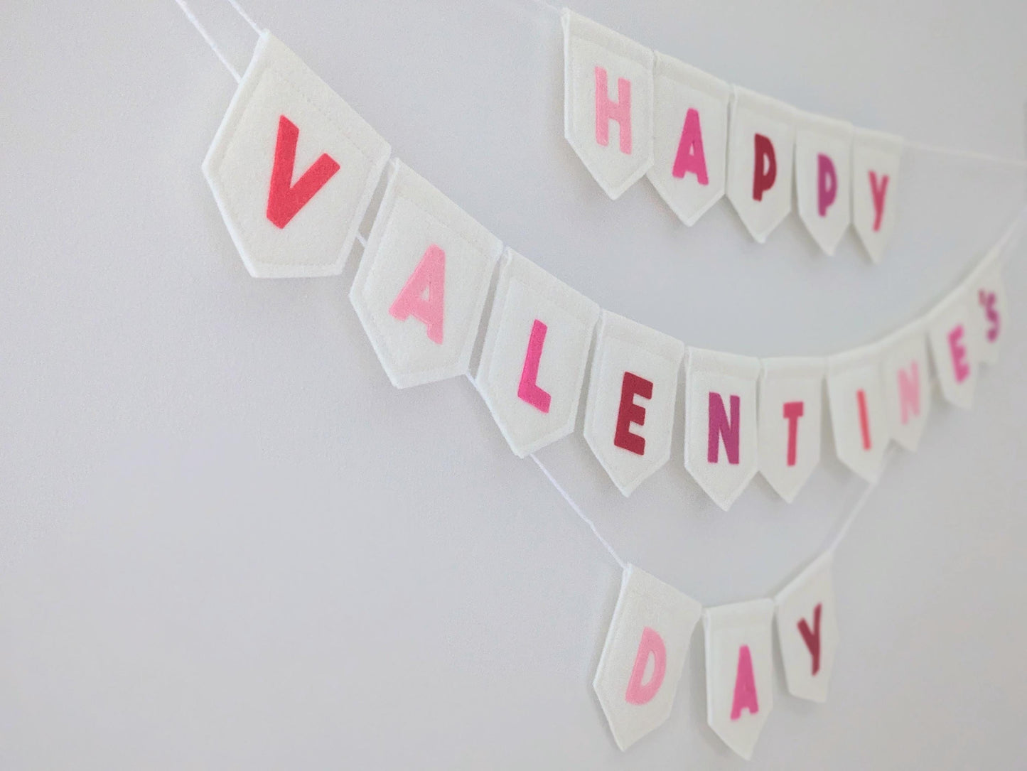 Felt Valentine's Day Banner: Handmade off-white bunting with pink and red lettering