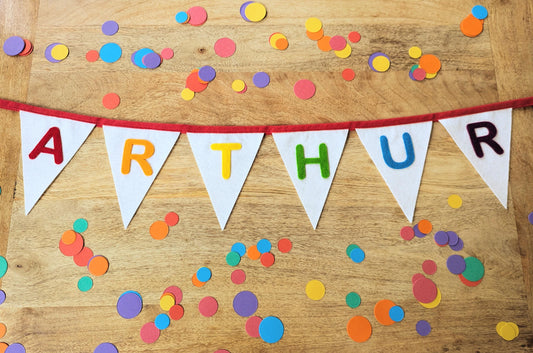 Custom personalised felt bunting with rainbow hand-cut lettering
