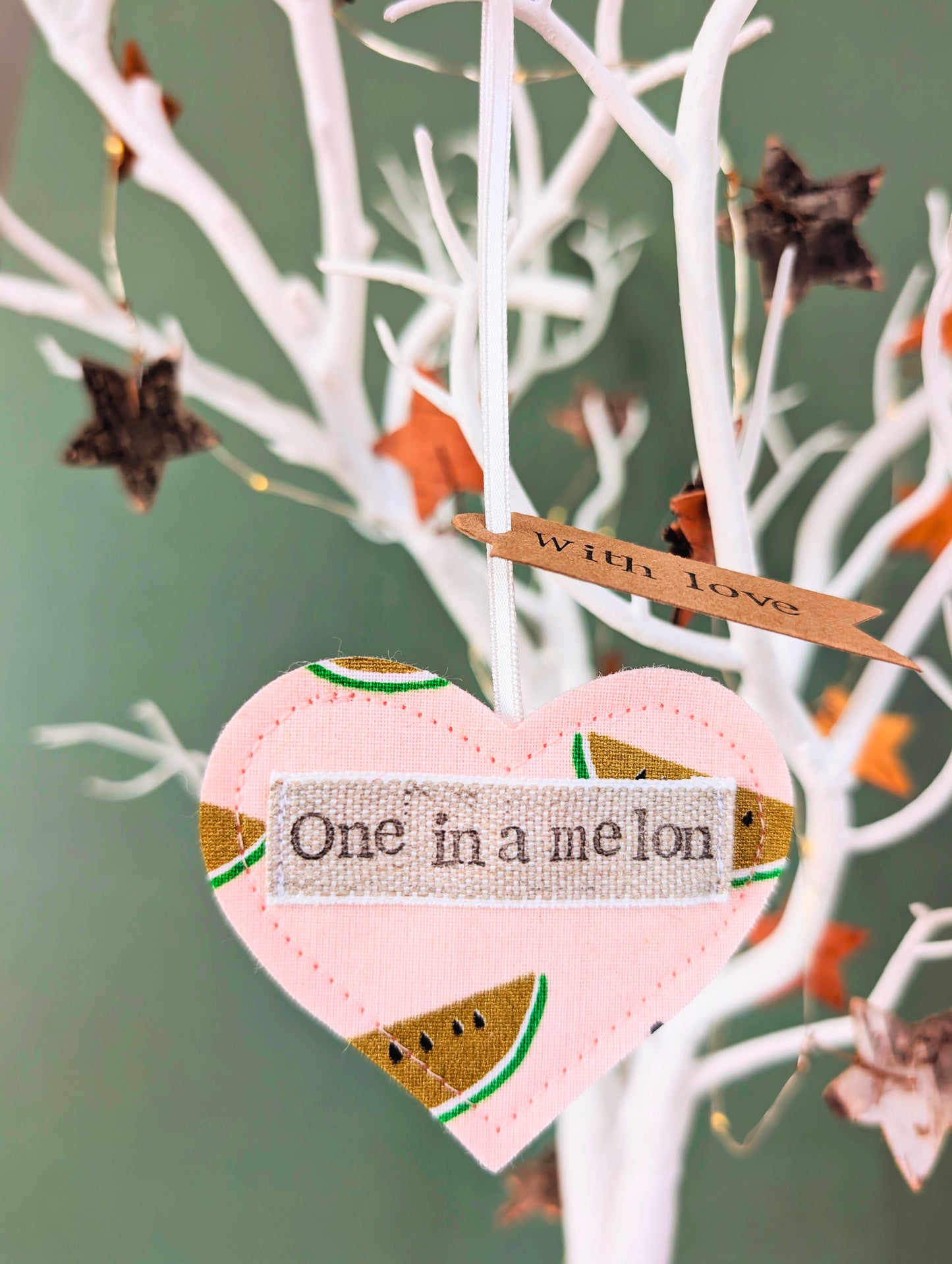 'One in a melon' hanging heart decoration with recycled plantable wildflower seed backing card
