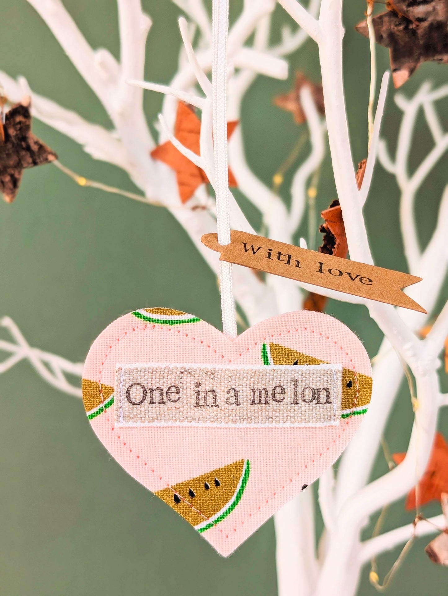 'One in a melon' hanging heart decoration with recycled plantable wildflower seed backing card