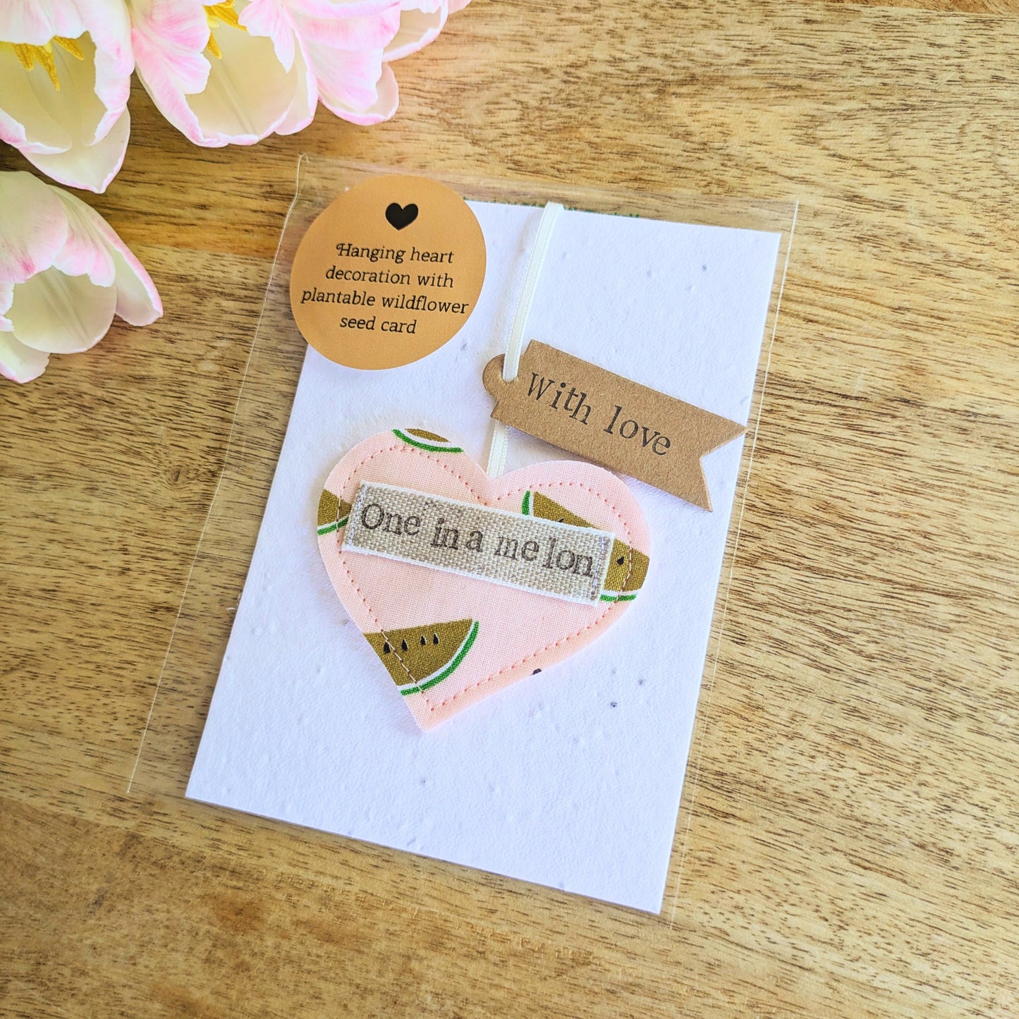'One in a melon' hanging heart decoration with recycled plantable wildflower seed backing card