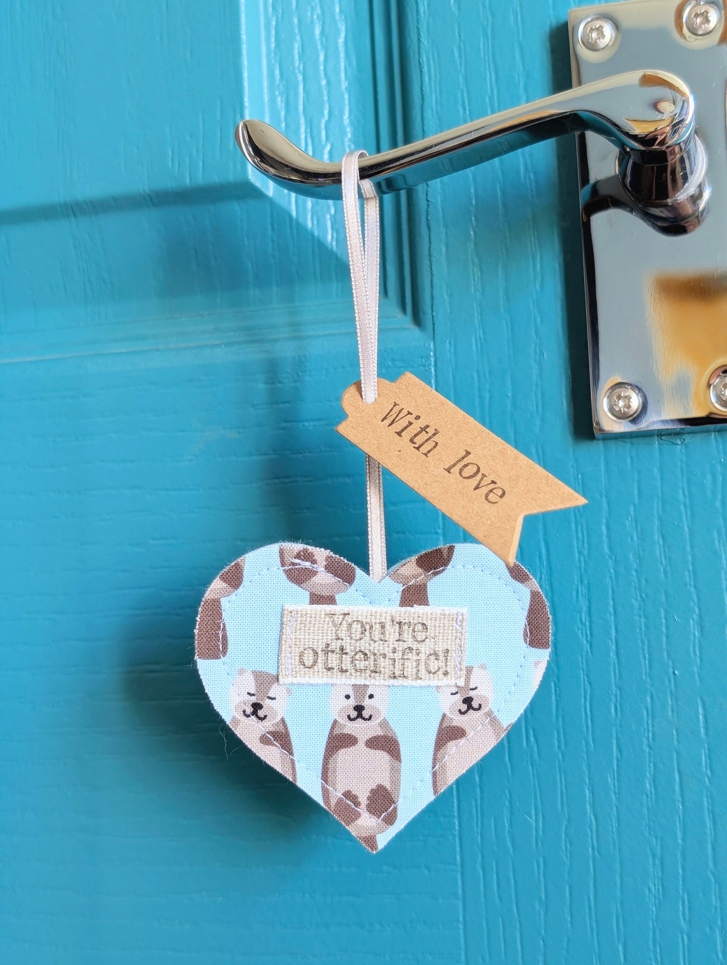 'You're otterific!' hanging heart decoration with plantable wildflower seed backing card