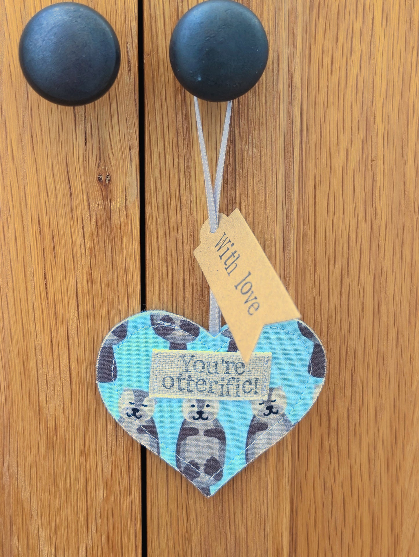 'You're otterific!' hanging heart decoration with plantable wildflower seed backing card