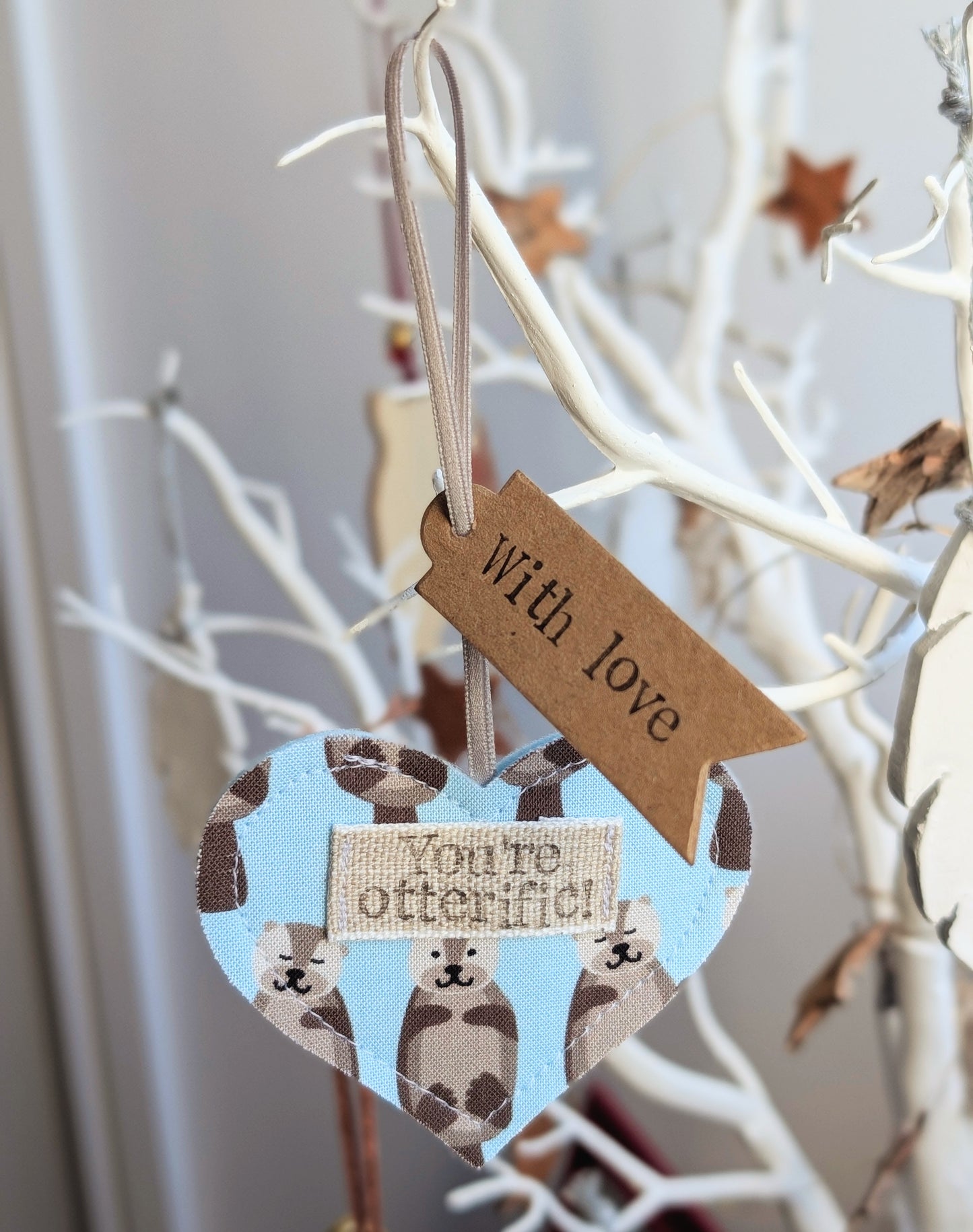 'You're otterific!' hanging heart decoration with plantable wildflower seed backing card