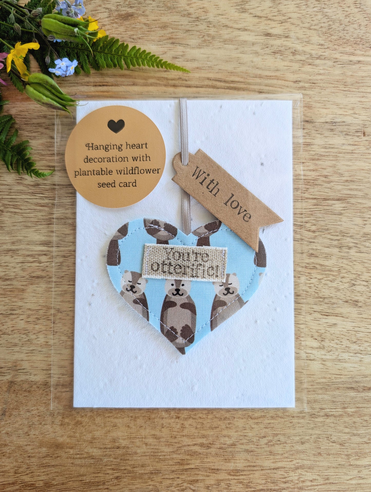 'You're otterific!' hanging heart decoration with plantable wildflower seed backing card