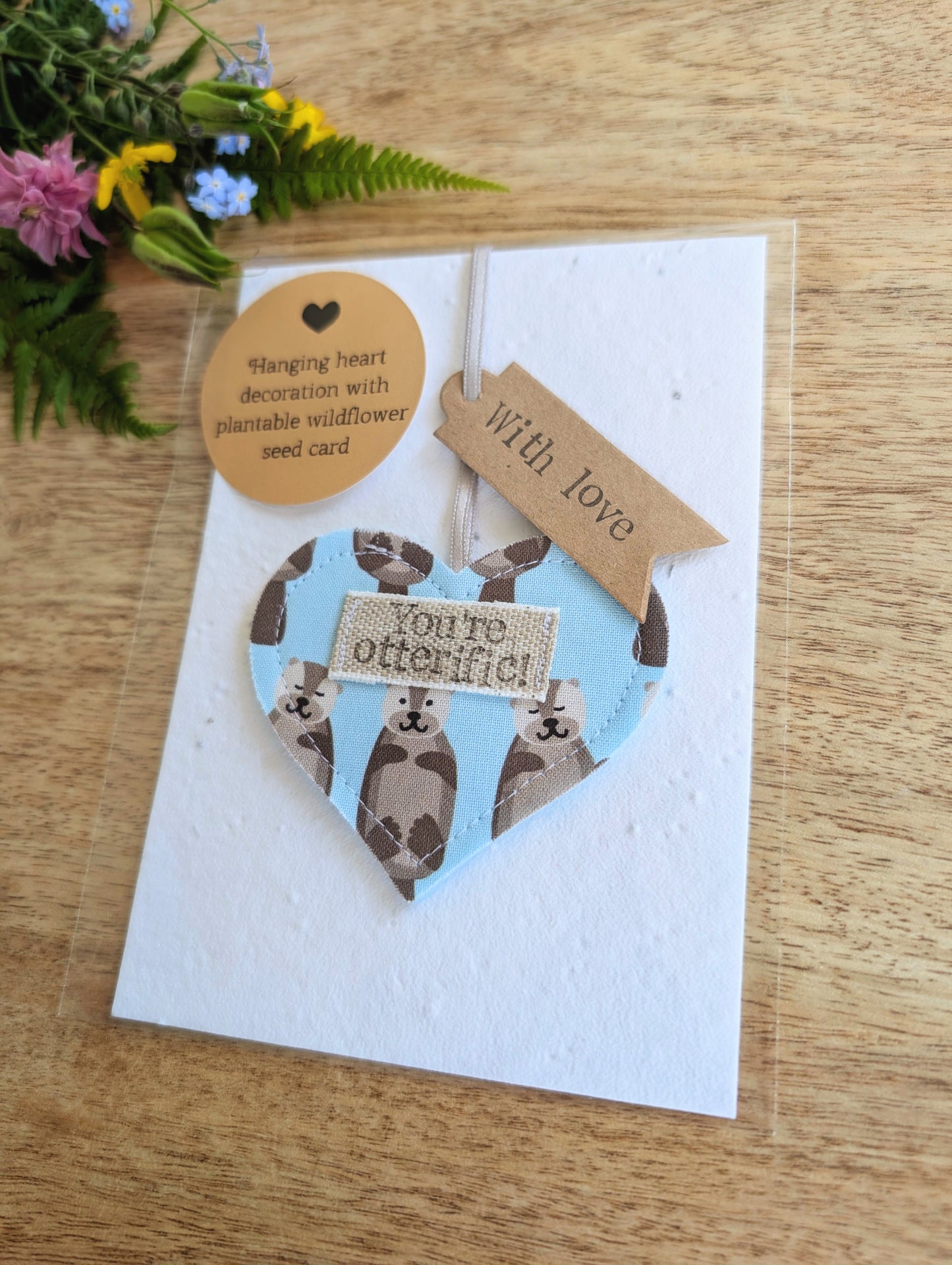'You're otterific!' hanging heart decoration with plantable wildflower seed backing card