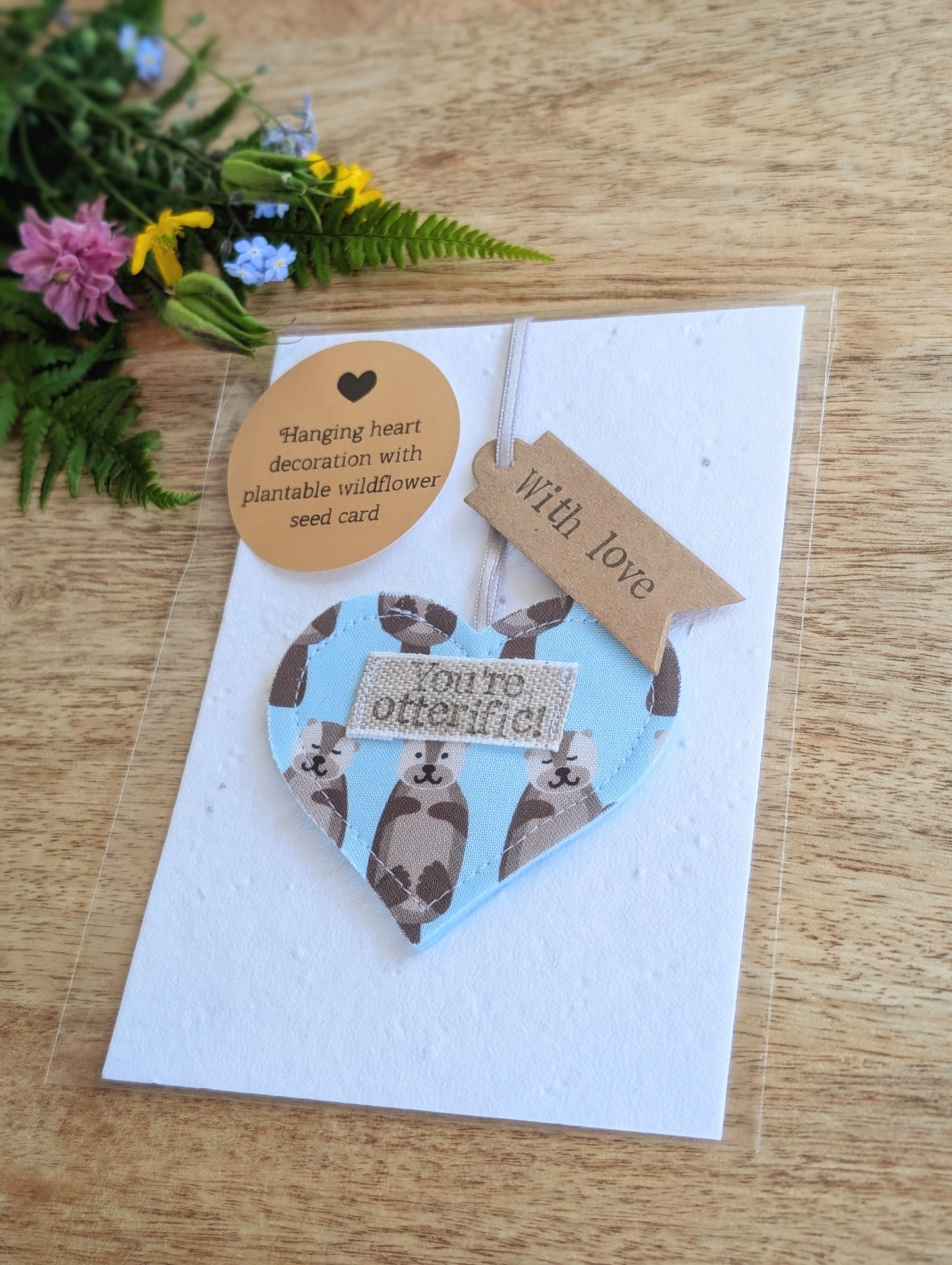 'You're otterific!' hanging heart decoration with plantable wildflower seed backing card