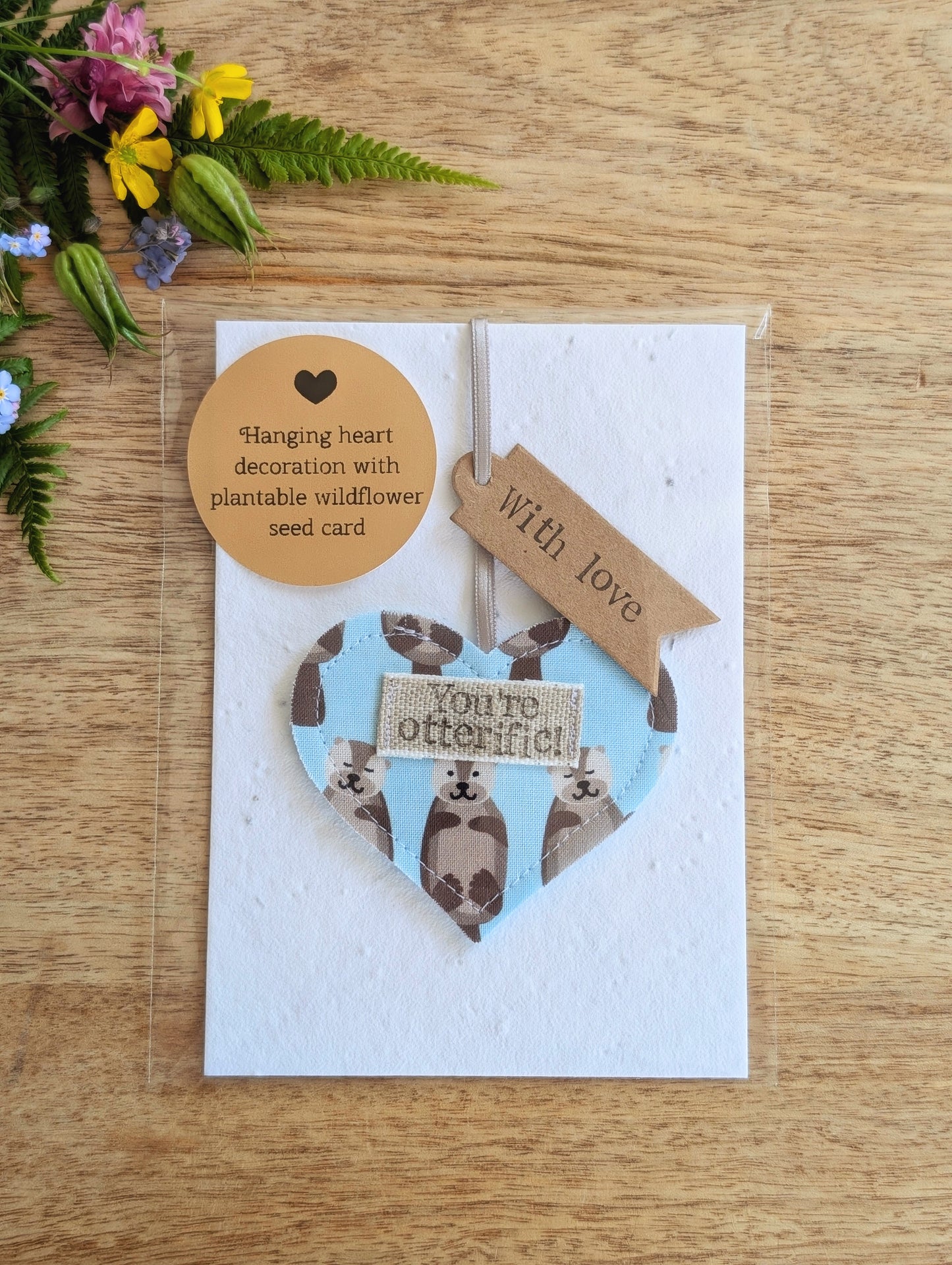 'You're otterific!' hanging heart decoration with plantable wildflower seed backing card