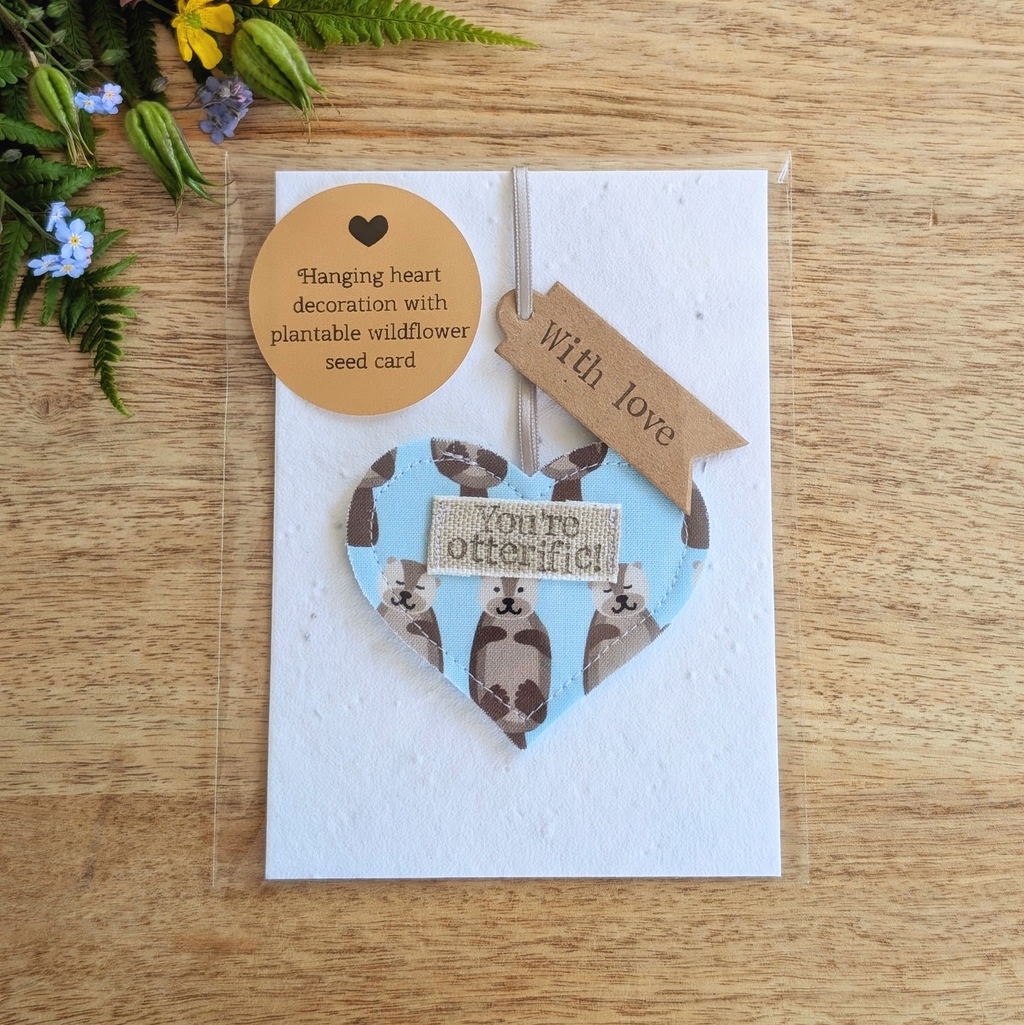'You're otterific!' hanging heart decoration with plantable wildflower seed backing card