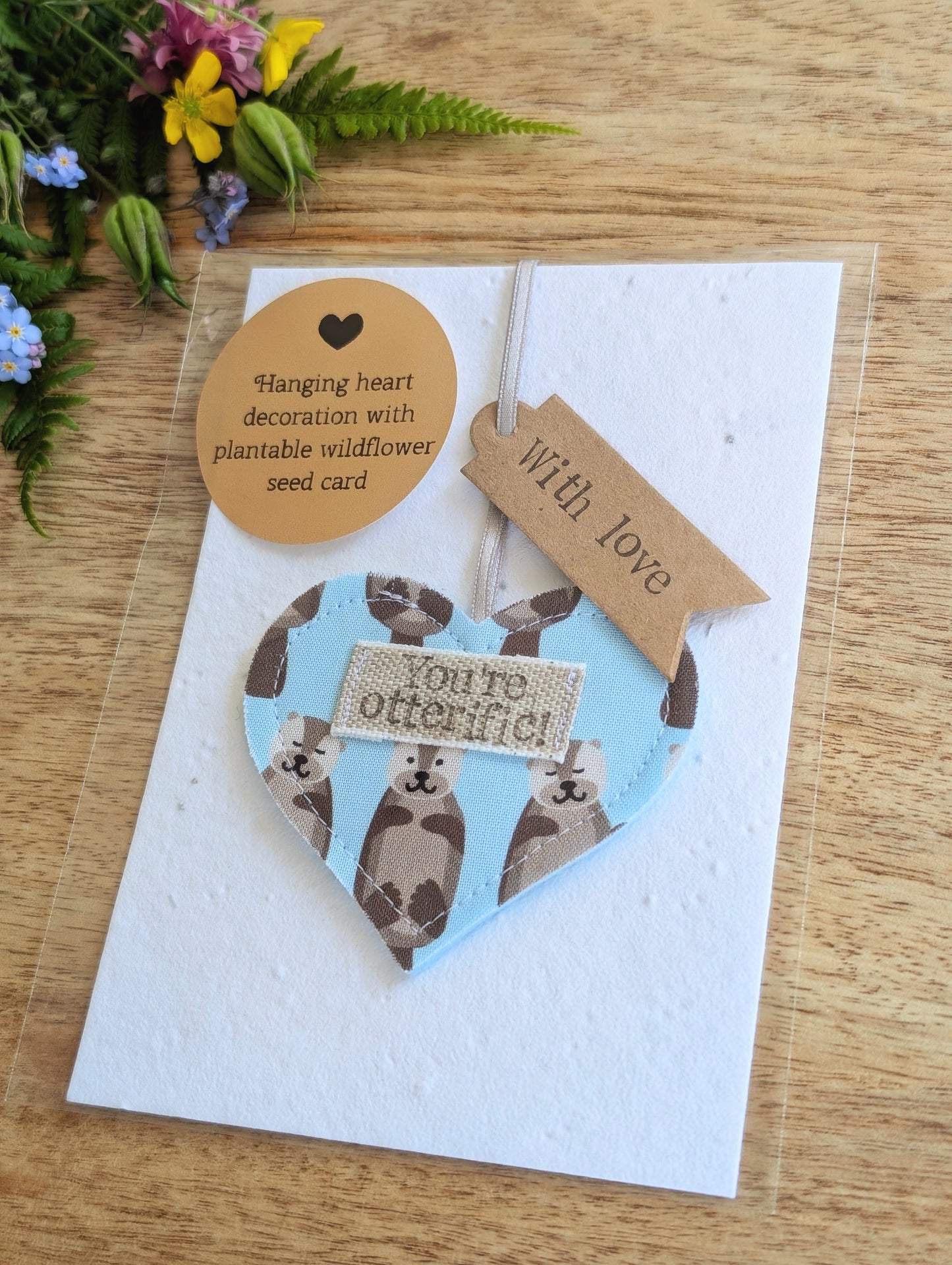 'You're otterific!' hanging heart decoration with plantable wildflower seed backing card