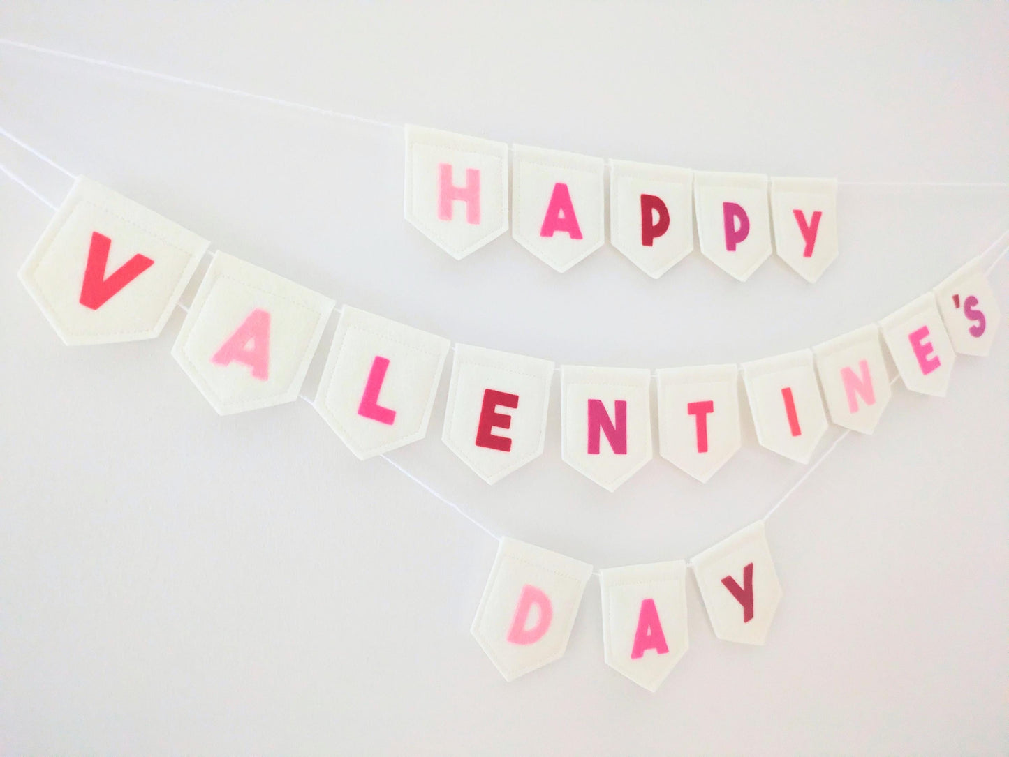 Felt Valentine's Day Banner: Handmade off-white bunting with pink and red lettering