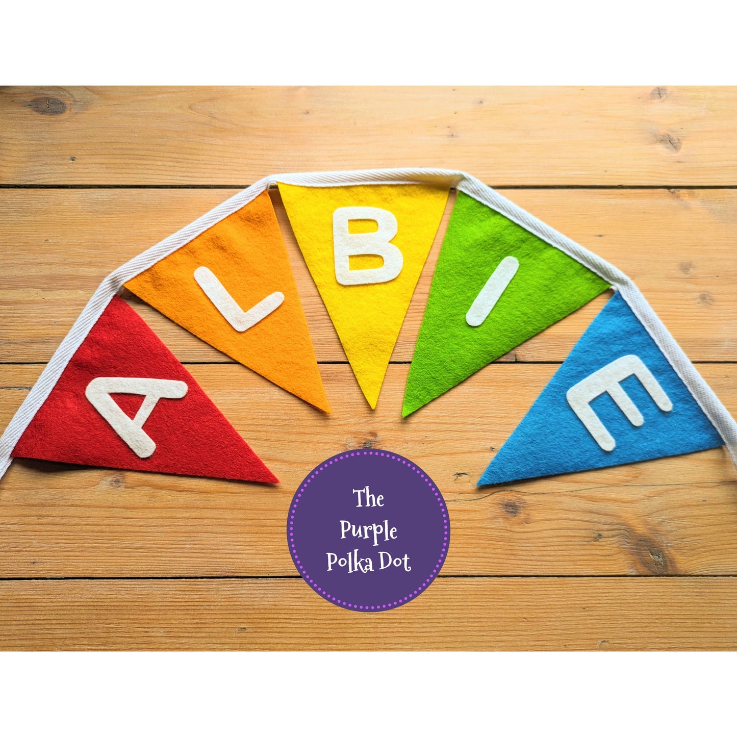 Custom personalised rainbow felt bunting with hand-cut lettering