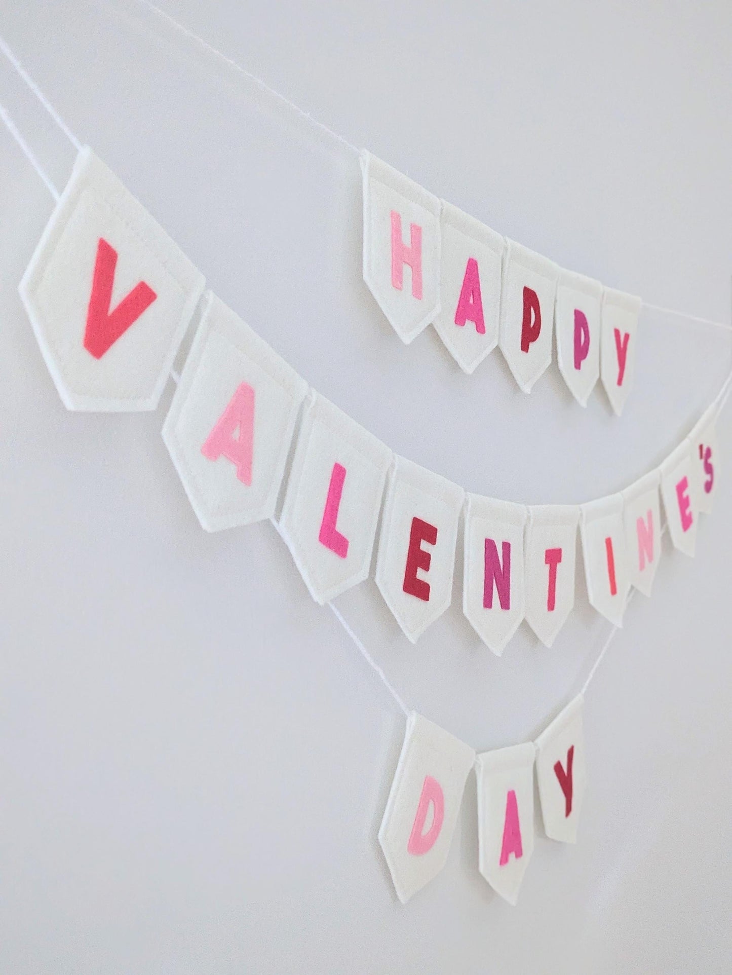 Felt Valentine's Day Banner: Handmade off-white bunting with pink and red lettering