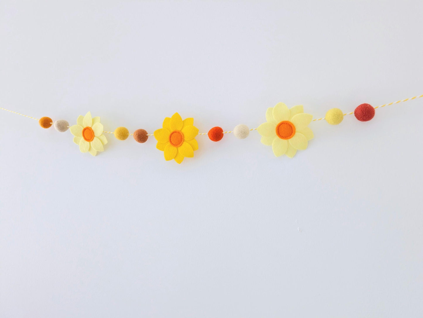 Yellow daffodil and felt ball garland: floral spring or Easter bunting