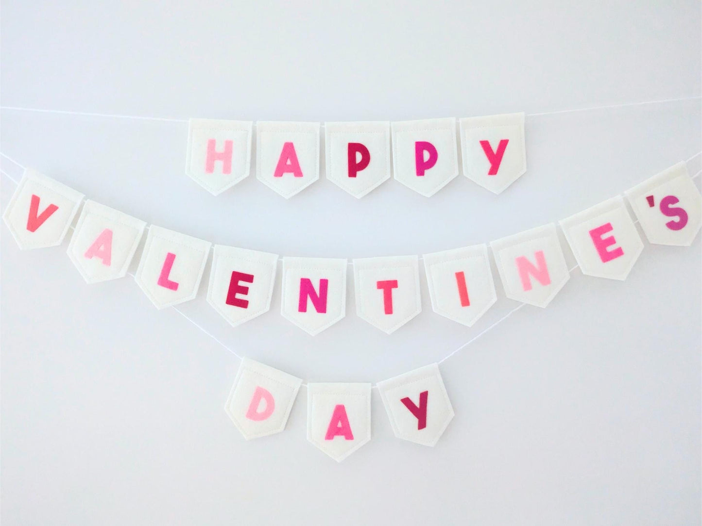 Felt Valentine's Day Banner: Handmade off-white bunting with pink and red lettering